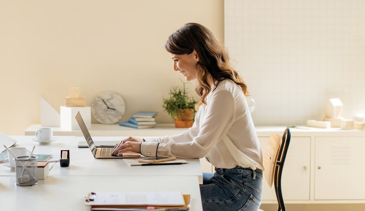Person reviewing a weekly posture exercise progress journal at a desk